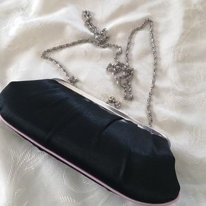 NWOT, black  clutch with pink piping and silver colored chain shoulder strap